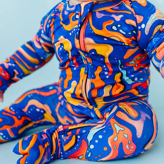 Colorful abstract-patterned outfit on a light blue background