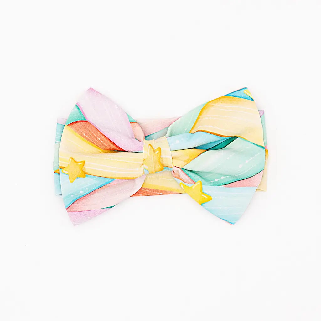 Colorful bow tie with a watercolor design on a white background