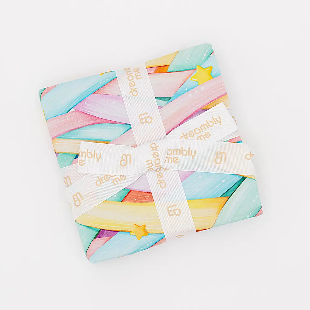 Pastel-colored fabric bundle with 'dreamy me' branding on a white background