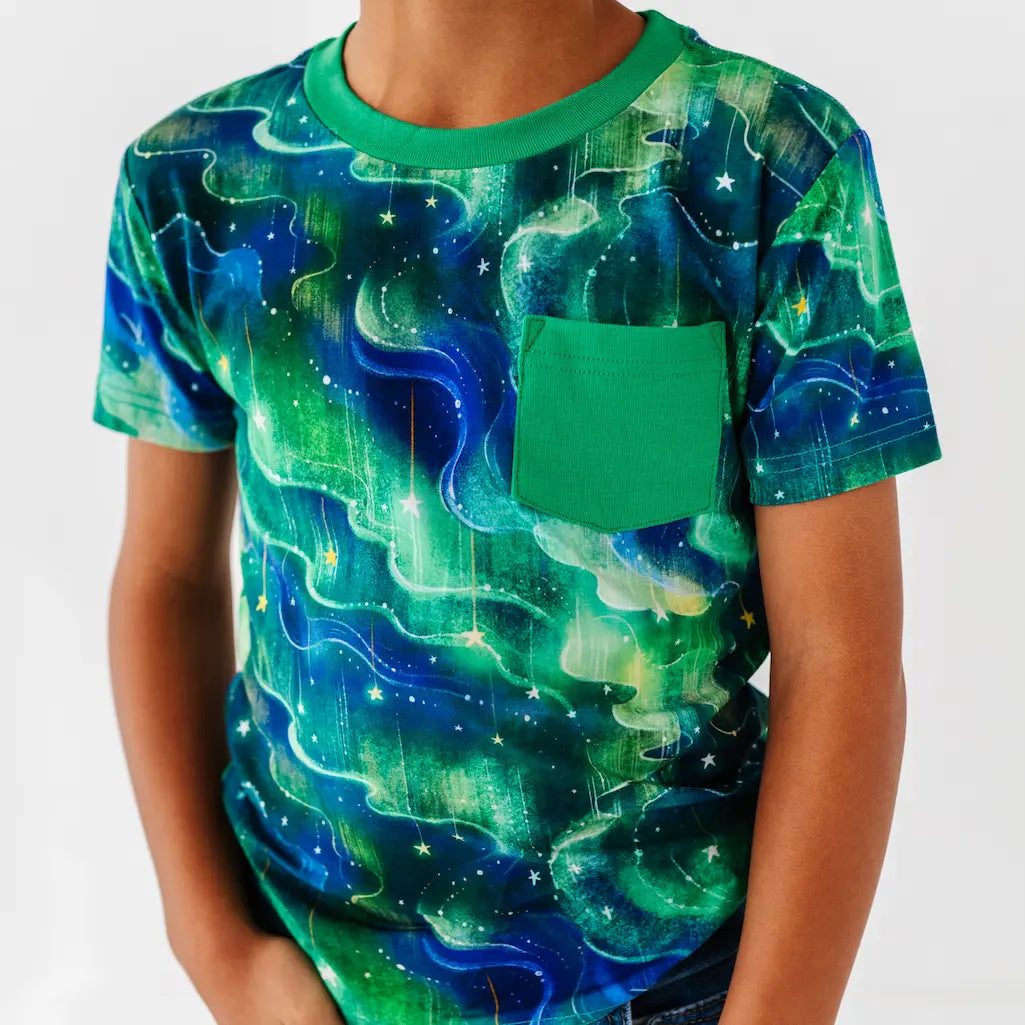 T-shirt with a green and blue cosmic design on a plain background