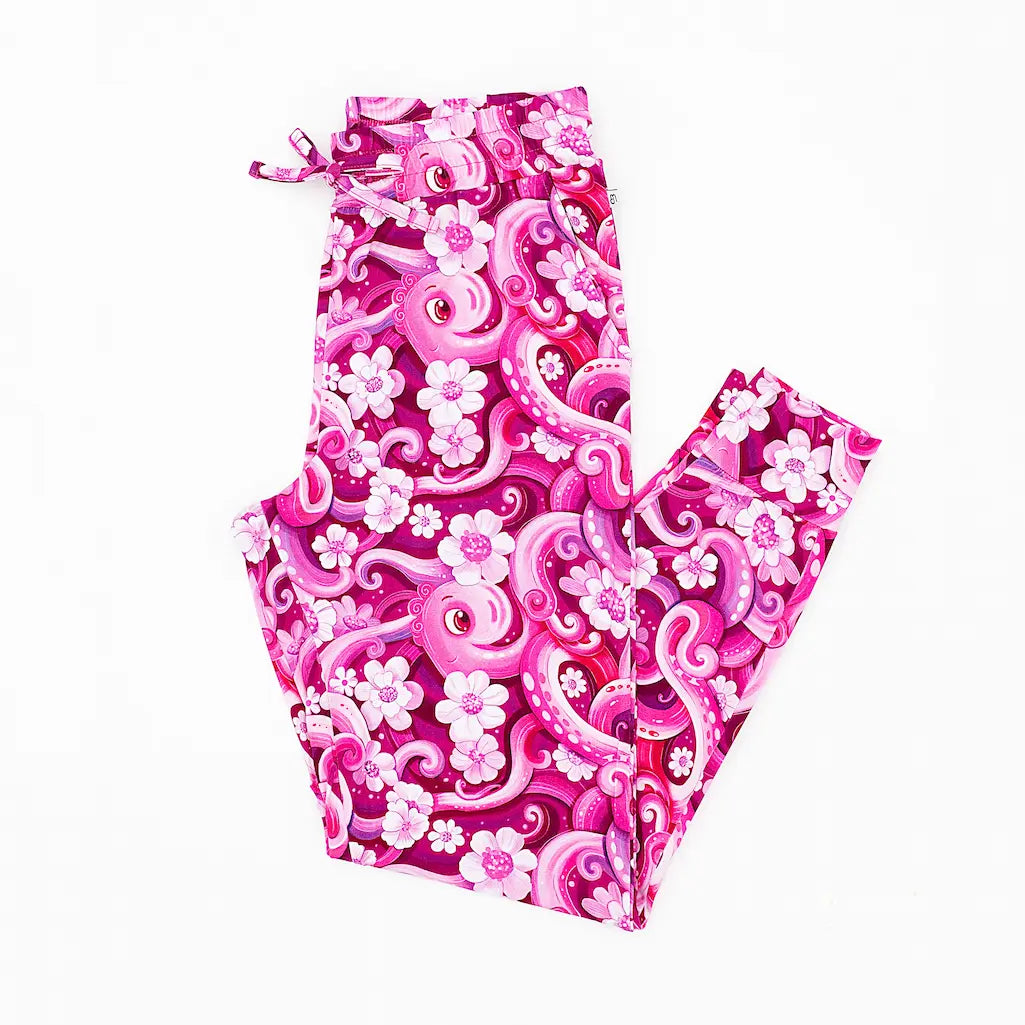 A pair of women's pajama pants with a playful pink octopus and white flower pattern.