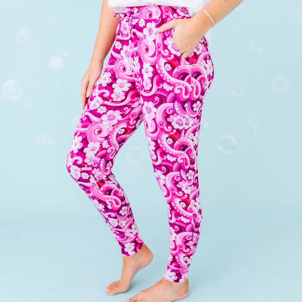 Pink and white patterned leggings on a plain background