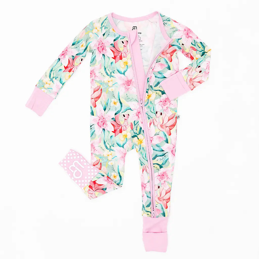 Floral-patterned baby onesie with matching headband on a white background