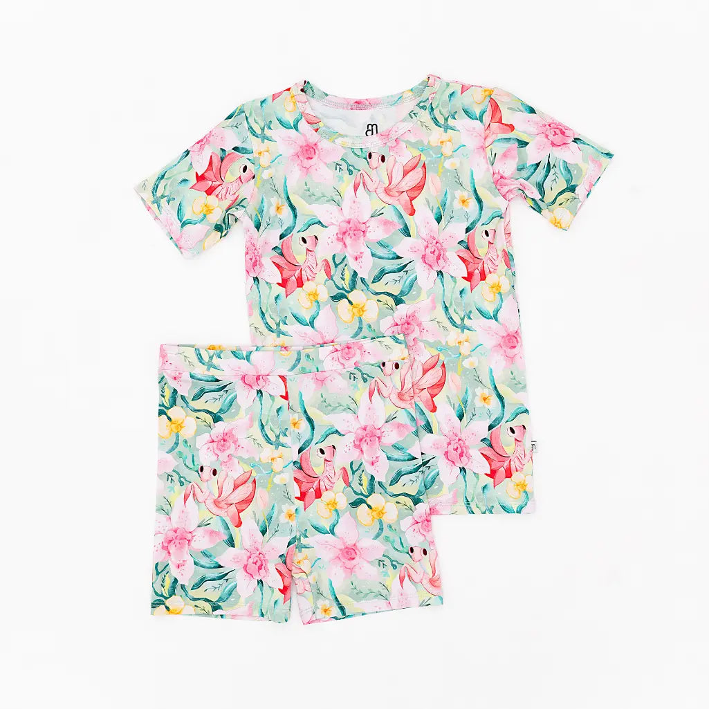 Floral pajama set with a top and shorts on a white background