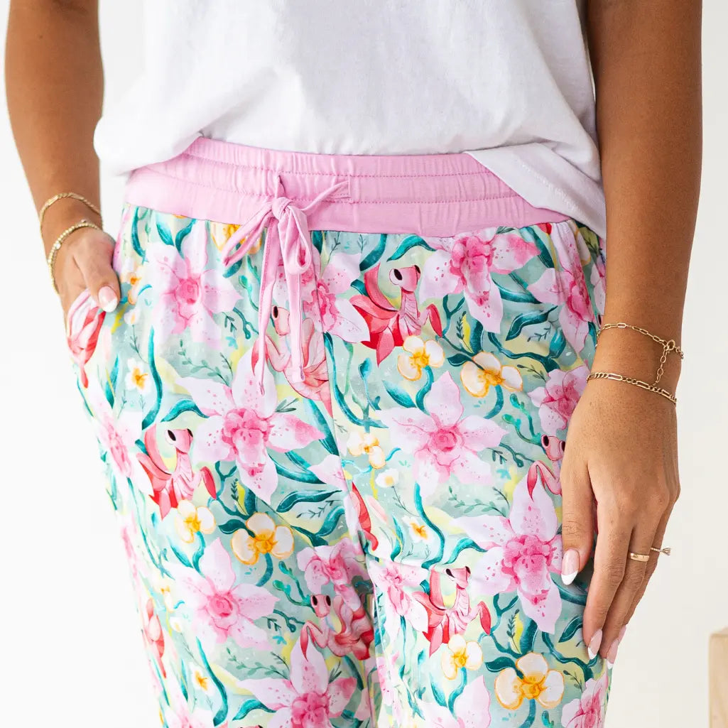 Floral pajama pants with pink drawstring on a white background