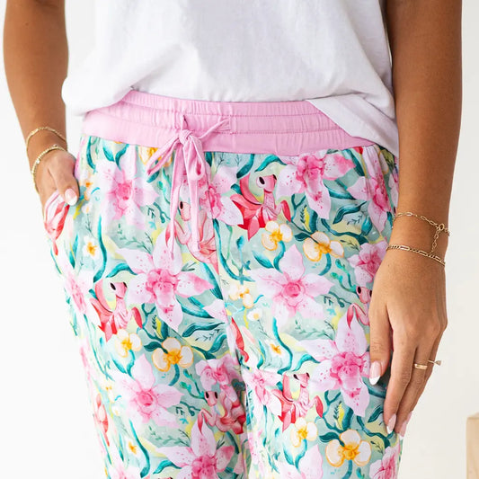 Floral pajama pants with pink drawstring on a white background