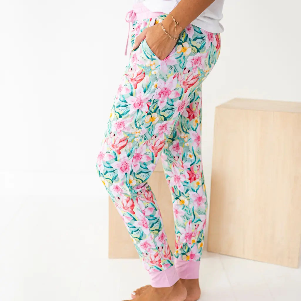 Floral patterned pajama pants worn by a person on a white background