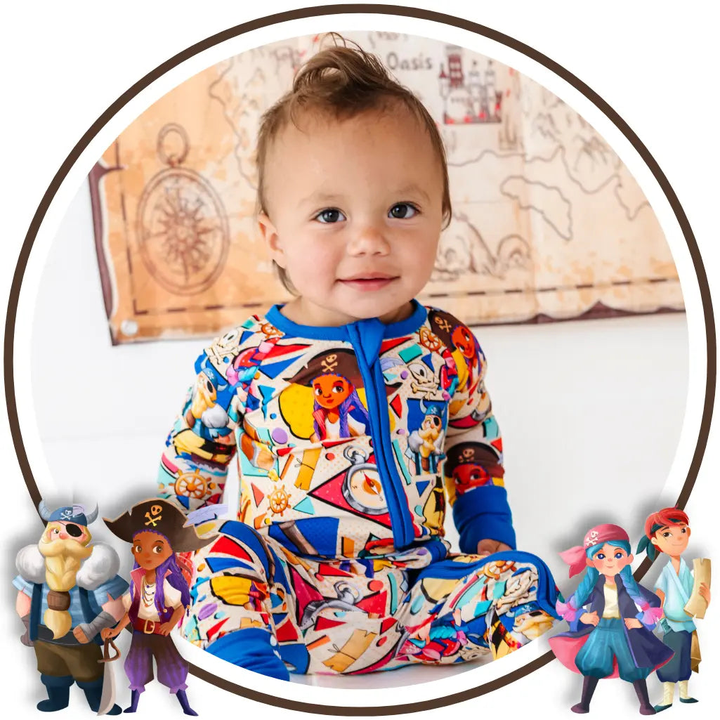 Child wearing a colorful onesie with cartoon characters, surrounded by toy figures.
