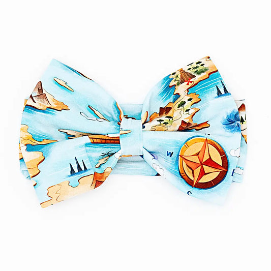 Bow tie with a nautical design featuring ships, stars, and a compass on a white background