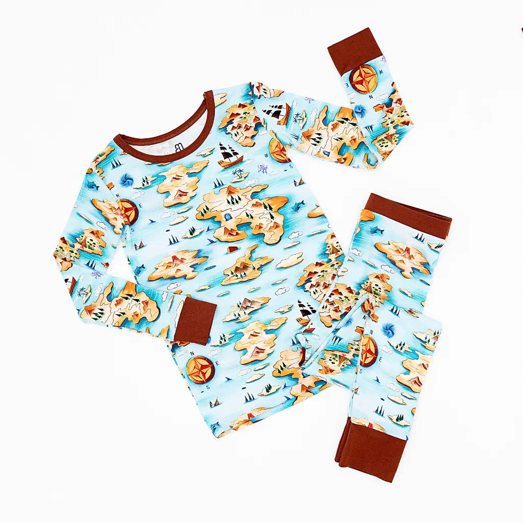 Children's pajama set with pizza-themed design on a white background