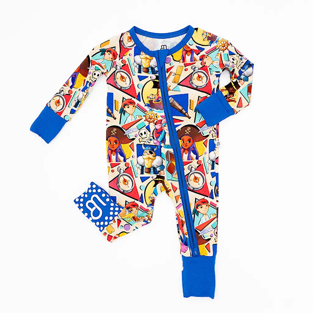 Colorful children's onesie with a pattern of cartoon characters and blue accents on a white background.