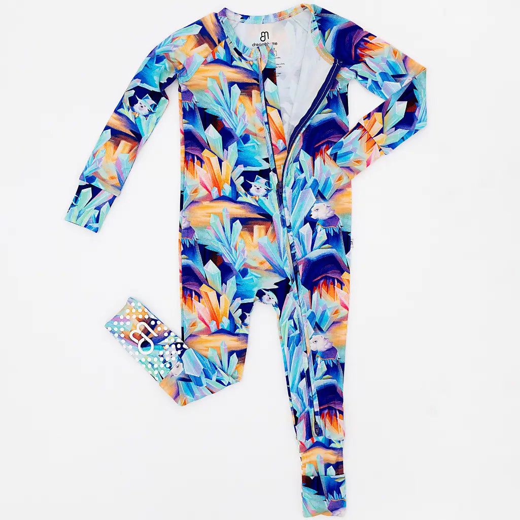 Colorful onesie with a tropical pattern on a white background