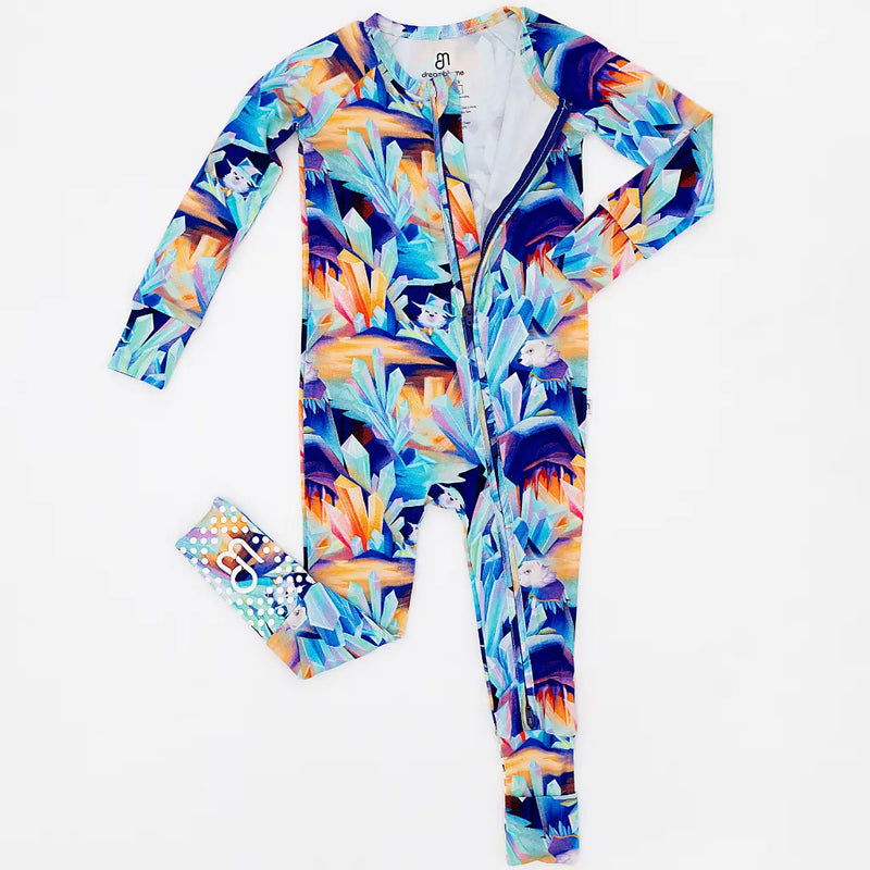 Colorful onesie with a tropical pattern on a white background