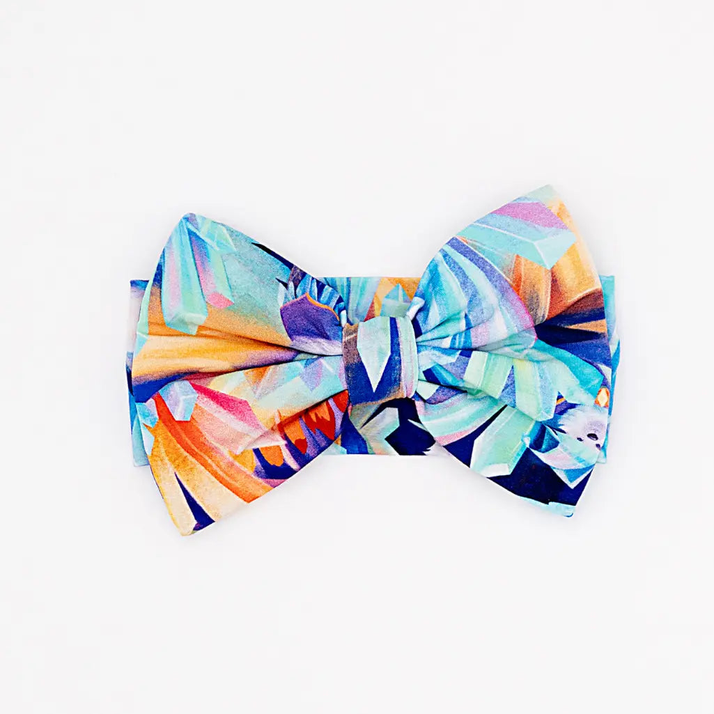 Colorful bow-shaped headband on a white background