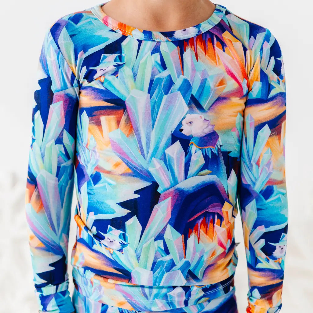 Colorful long-sleeve shirt with abstract design on a white background