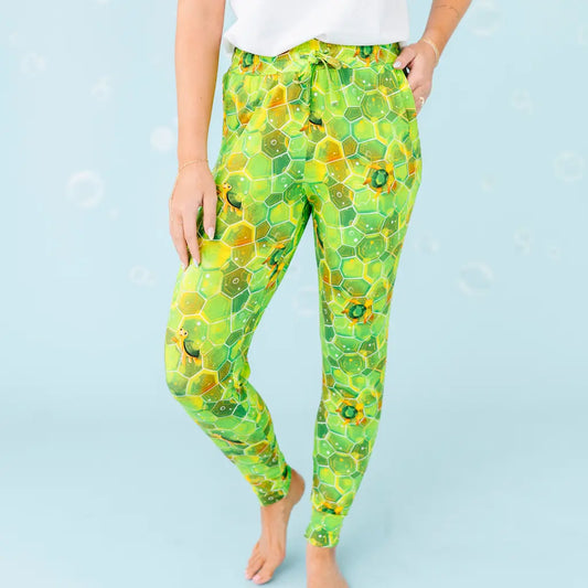 Green leggings with a geometric pattern on a light blue background