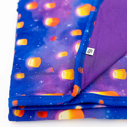 Folded fabric with candy corn pattern on a purple background