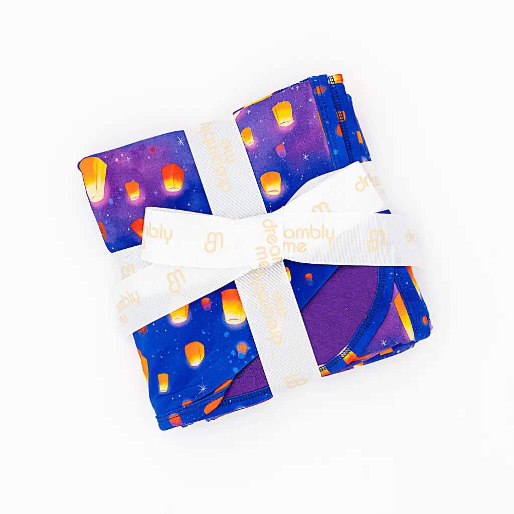 Set of fabric squares with a space-themed design on a white background