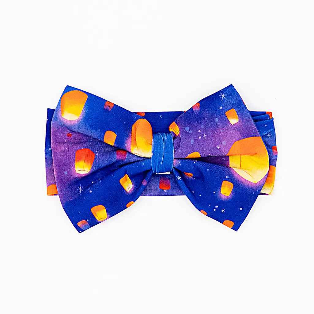 Bow tie with colorful lantern design on a white background