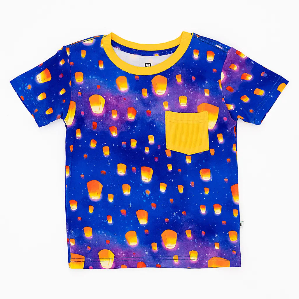 Children's t-shirt with sky lanterns pattern on a blue background