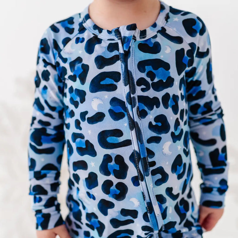 Children's blue and black leopard print swimsuit on a white background