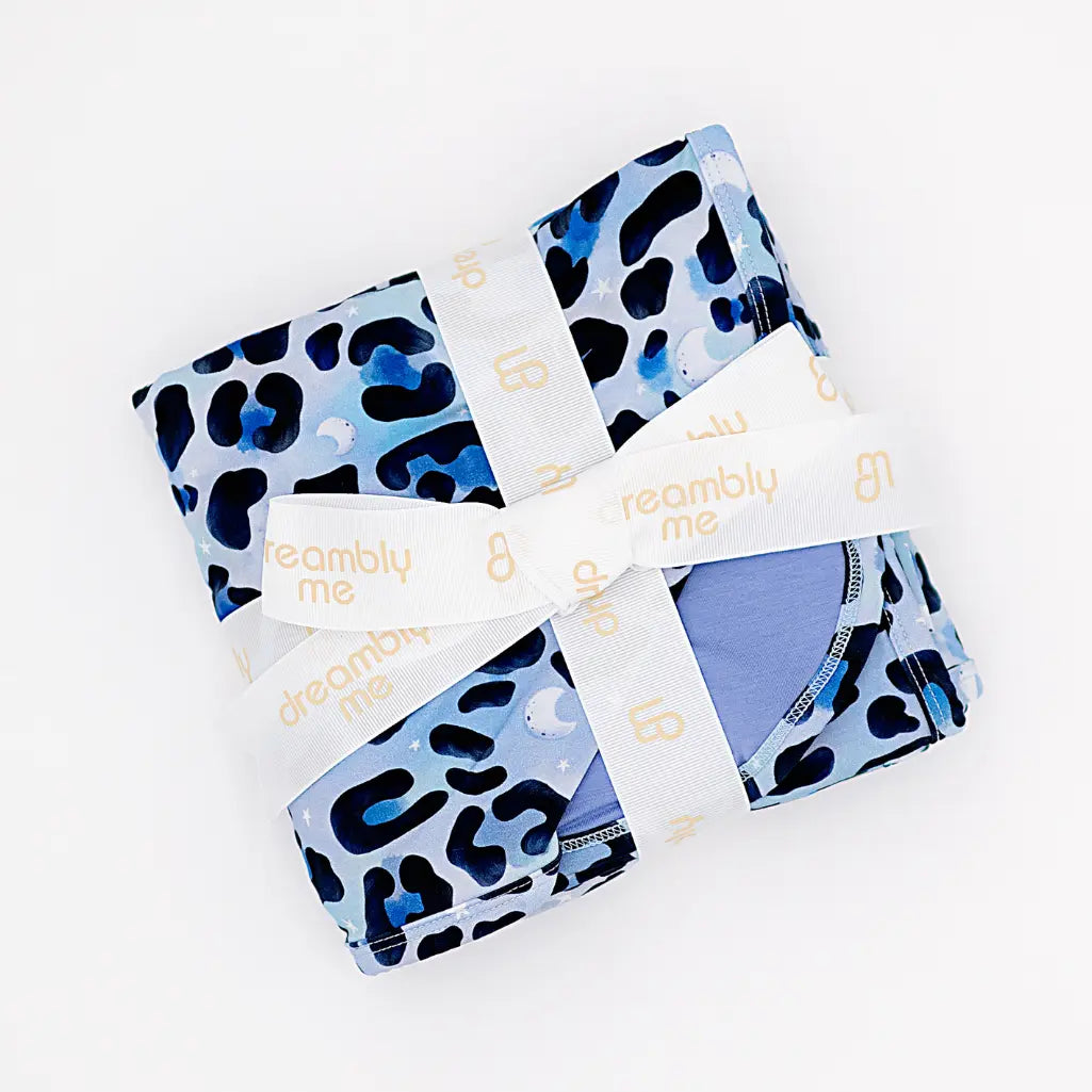 Packaged product with blue and black leopard print pattern on a white background