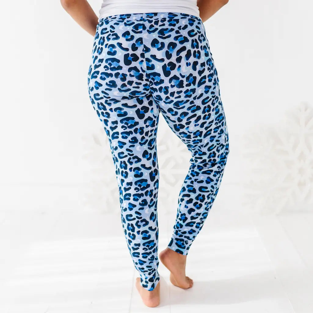 Blue leopard print leggings worn by a person on a white background