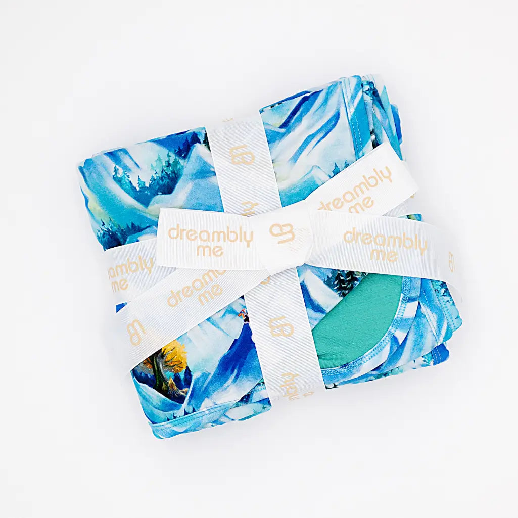 Blue and green patterned fabric with 'dreamily me' labels on a white background