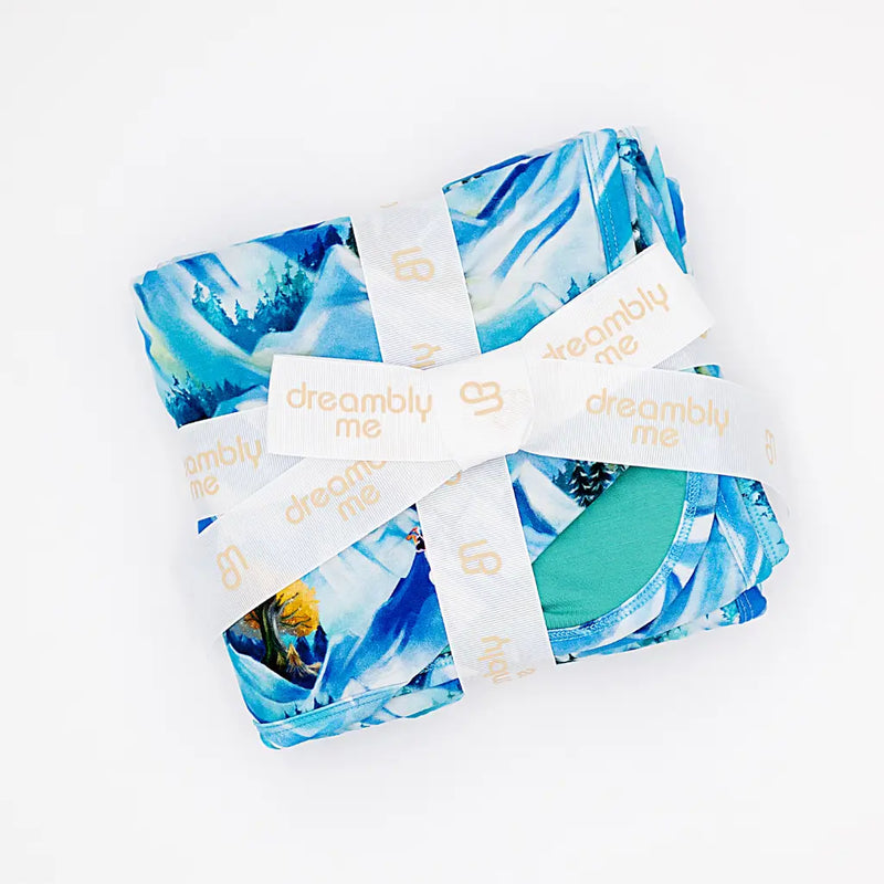 Blue and green patterned fabric with 'dreamily me' labels on a white background