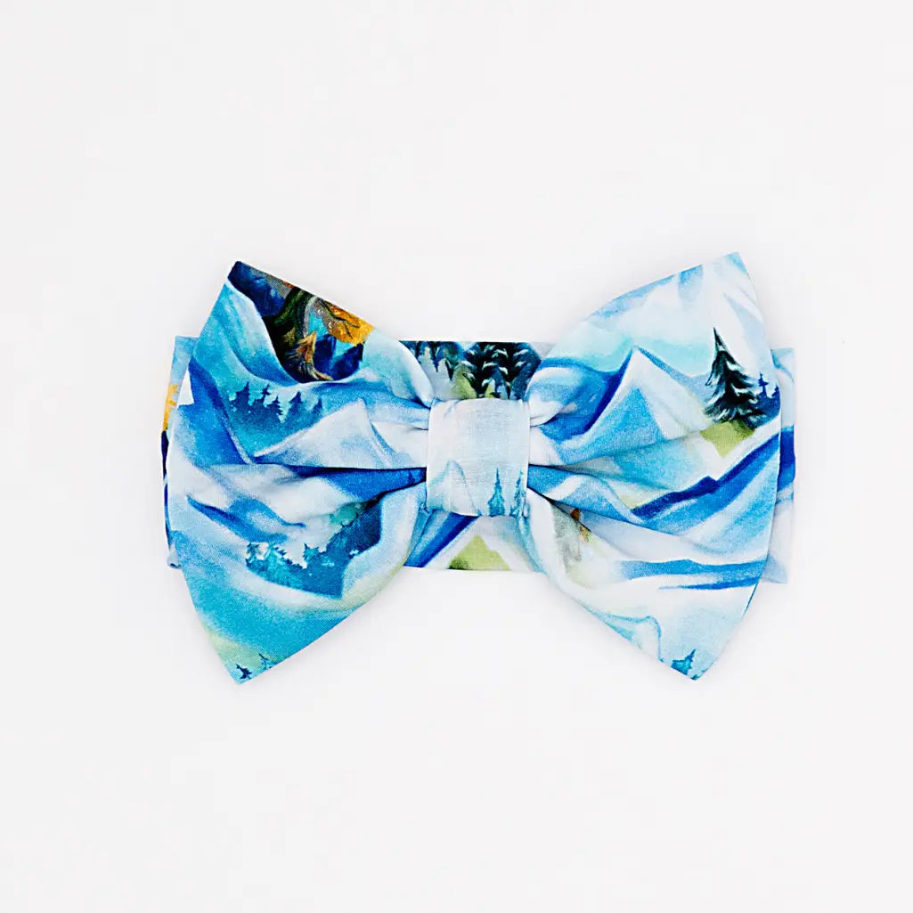 Blue and white patterned bow tie on a white background