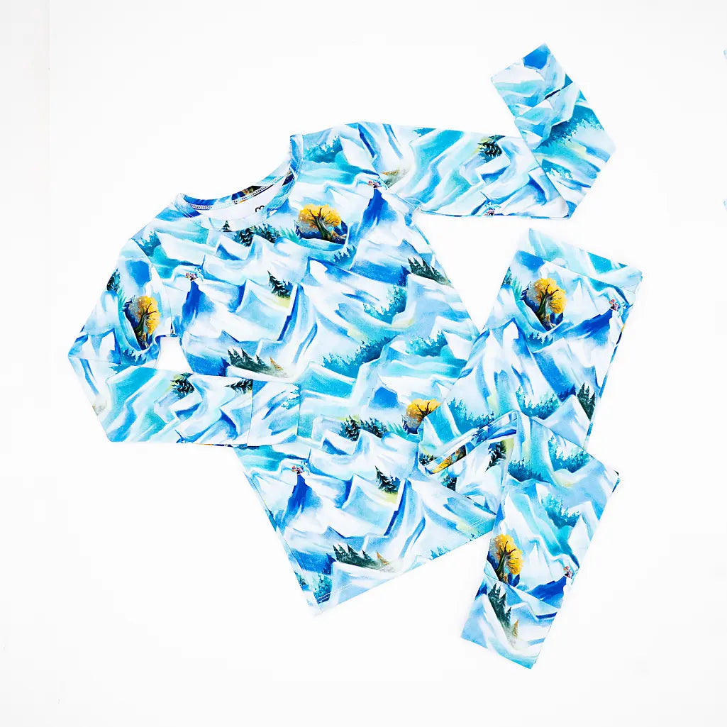 Children's swimsuit set with blue and white floral pattern on a white background