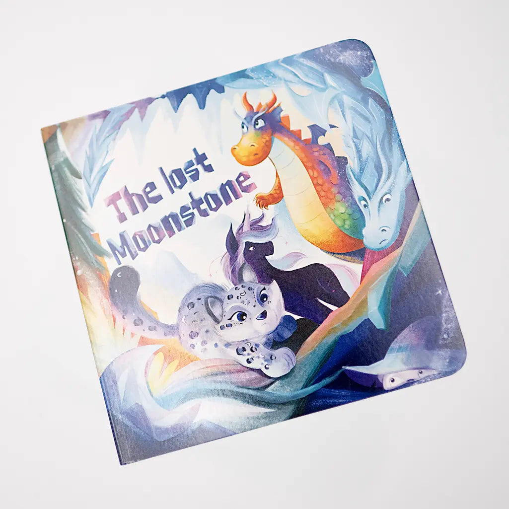 Children's book titled 'The Lost Moonstone' with colorful dragons on the cover