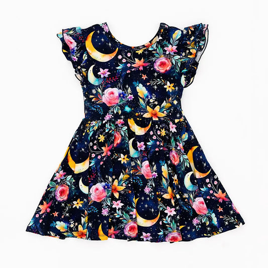 Dress with celestial and floral pattern on a white background