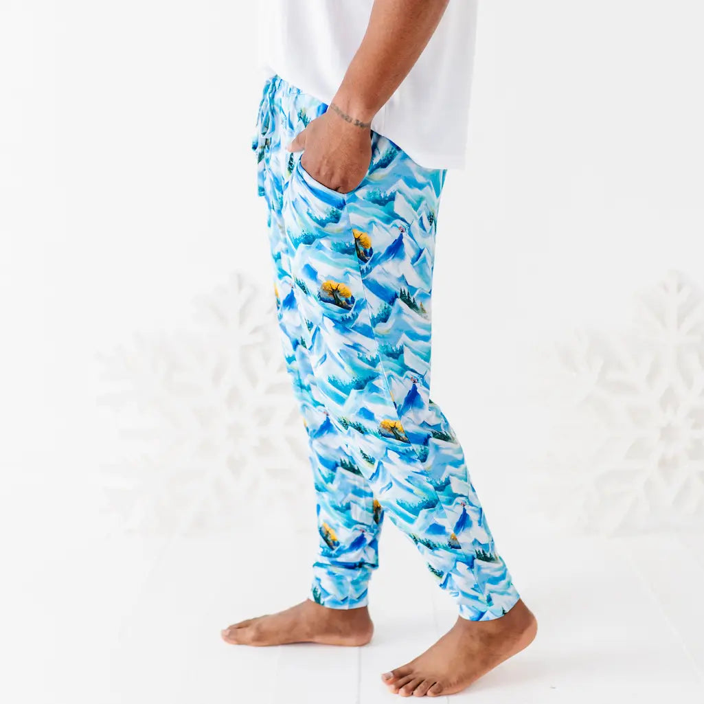 Person wearing blue patterned pants on a white background