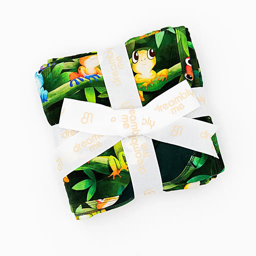 Set of children's books with frog illustrations on a white background