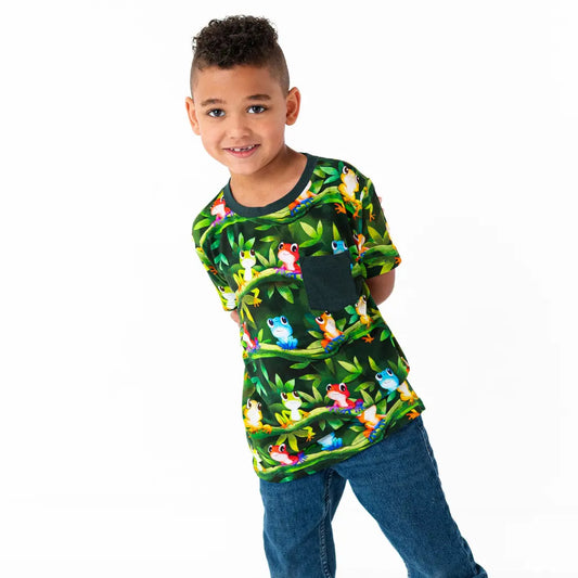 Child wearing a colorful shirt with animal prints on a white background