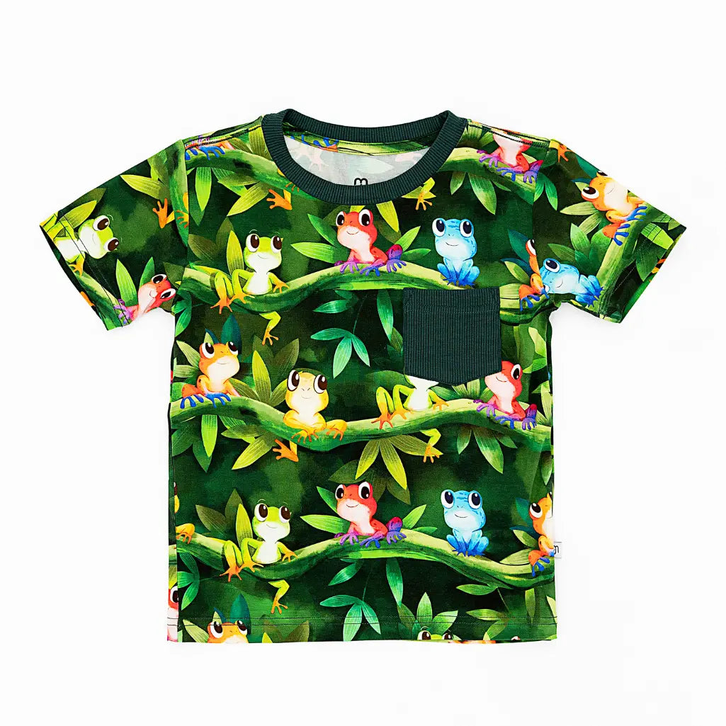 Children's t-shirt with colorful frog and leaf pattern on a white background