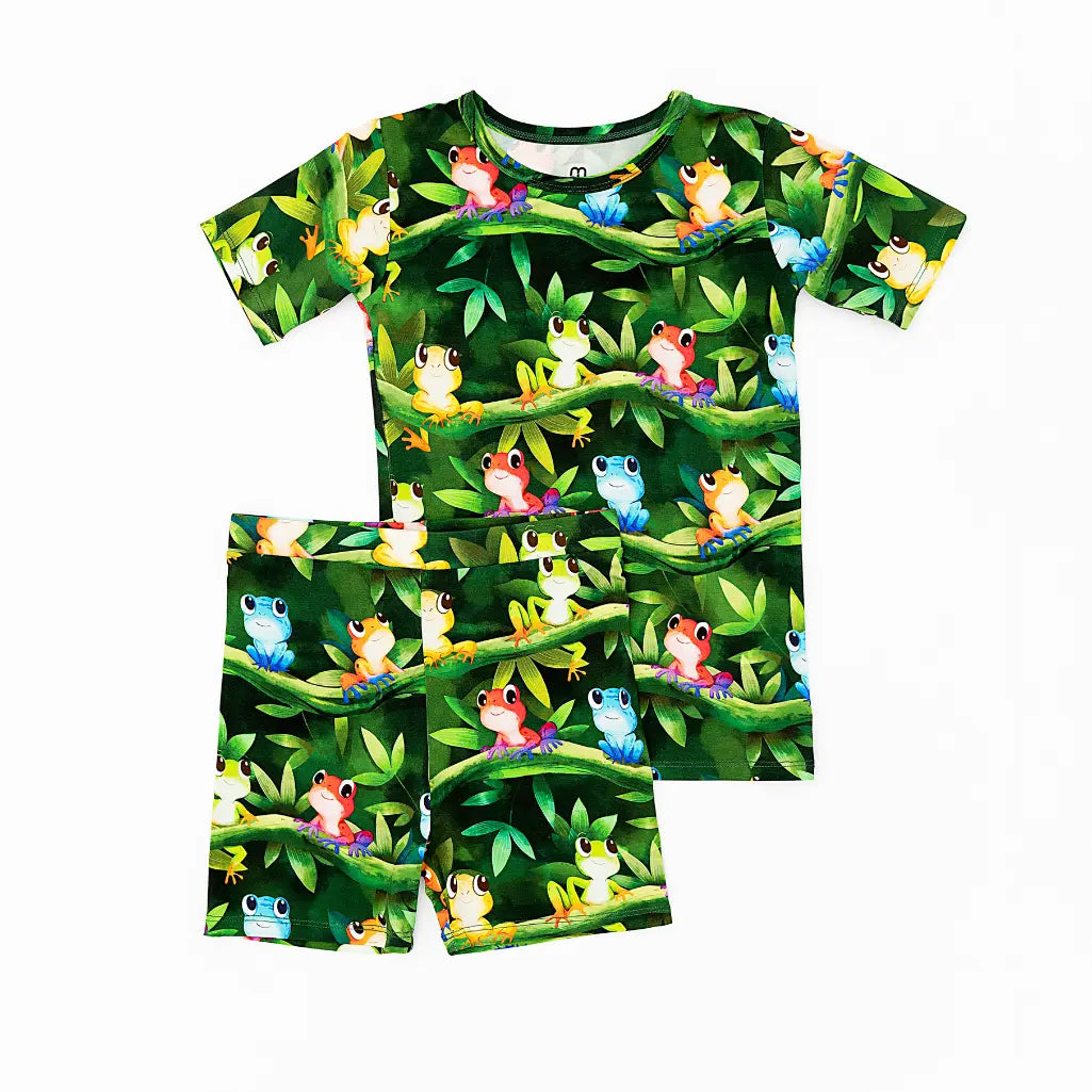 Children's pajama set with frog pattern on a white background
