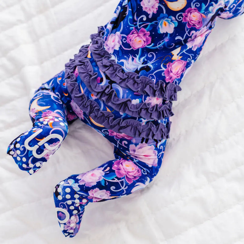 Floral-patterned leggings with ruffled waistband on a white background