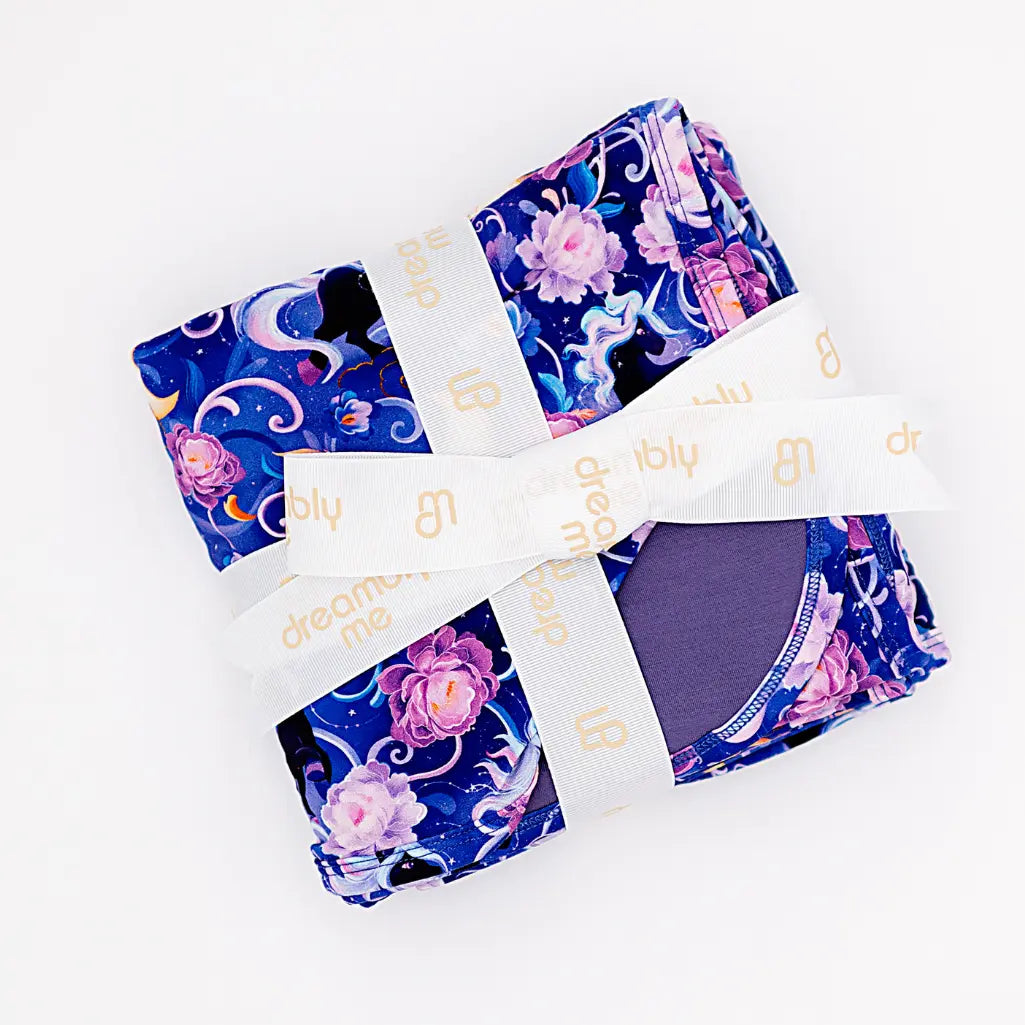 Set of women's underwear with floral and moon designs on a white background