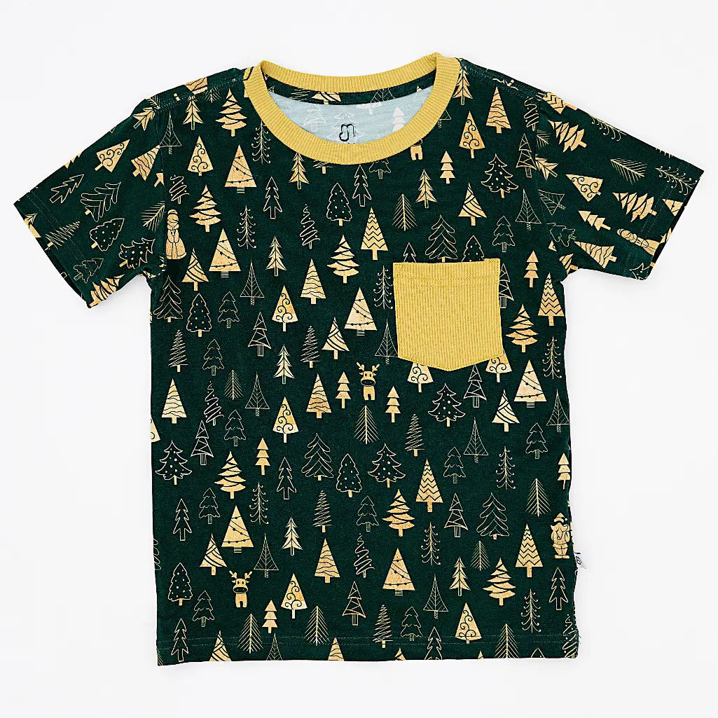 Flat lay of a short sleeve pocket tee with a mustard ribbed collar and pocket in a dark green print of gold Christmas trees on a white background.