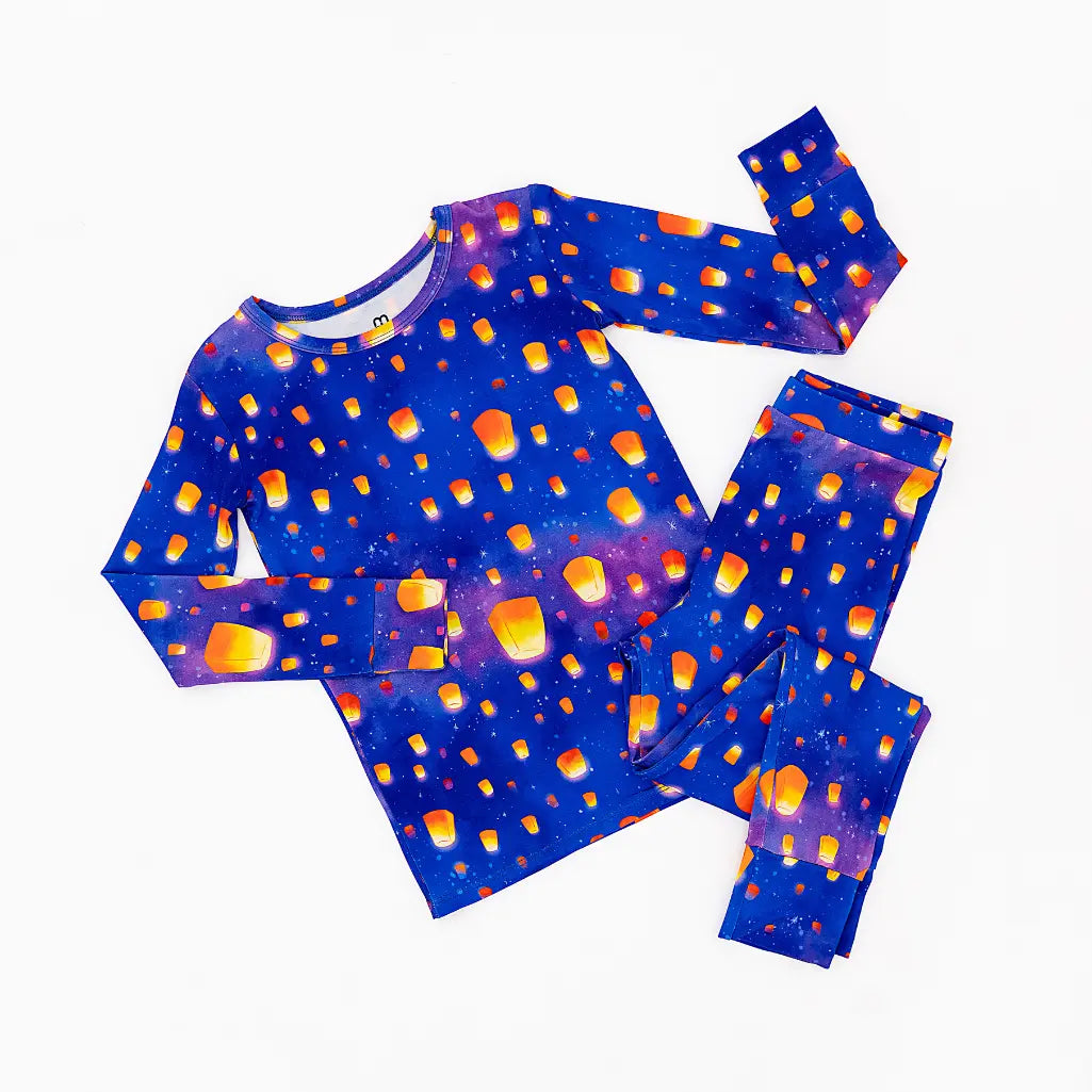 Children's pajama set with pumpkin pattern on a blue background